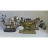 Metal doorstops, two pewter tankards, a metal model of a stag, a bell, figures, etc.