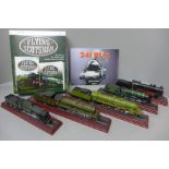 Six models of steam locomotives on wooden plinths and a Flying Scotsman DVD and book set