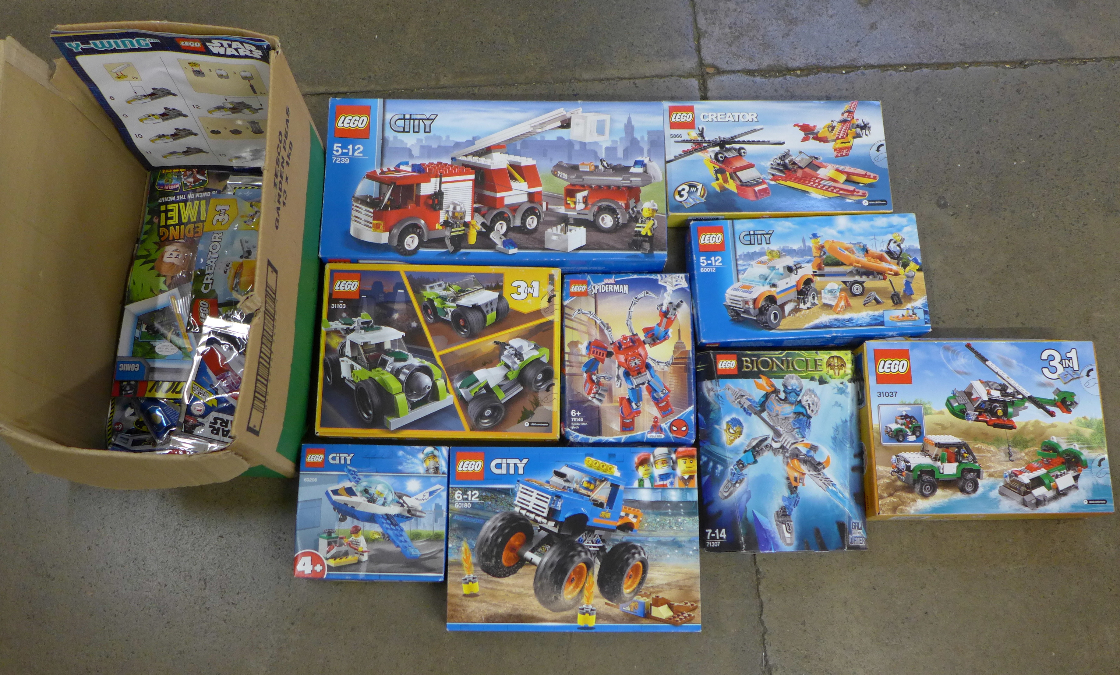 A collection of Lego, four Lego City box sets, two Lego Creator box sets, Bionicle, Spiderman and