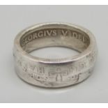 A silver half-crown ring, U