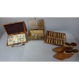Travel dominoes, a musical box, travel backgammon and a small pair of leather cowboy boots