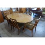 A G-Plan teak extending dining table and six chairs