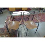 A pair of mid 20th Century Staples Ladderax steel and leather armchairs
