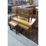 A teak nest of tables and a magazine rack