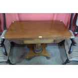 A Victorian carved walnut fold-over tea table