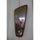 A teak framed mirror