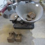 A set of vintage weighing scales with weights