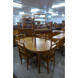 A McIntosh teak extending dining table and six chairs