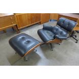 A Ray and Charles Eames style black leather lounge chair and stool, a/f