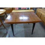 A tola wood and black extending dining table