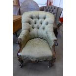 A Victorian rosewood and upholstered armchair