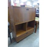 A teak cocktail cabinet