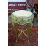 An Italian giltwood and marble top jardiniere stand