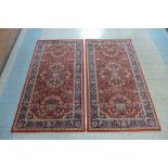 A pair of eastern red ground rugs