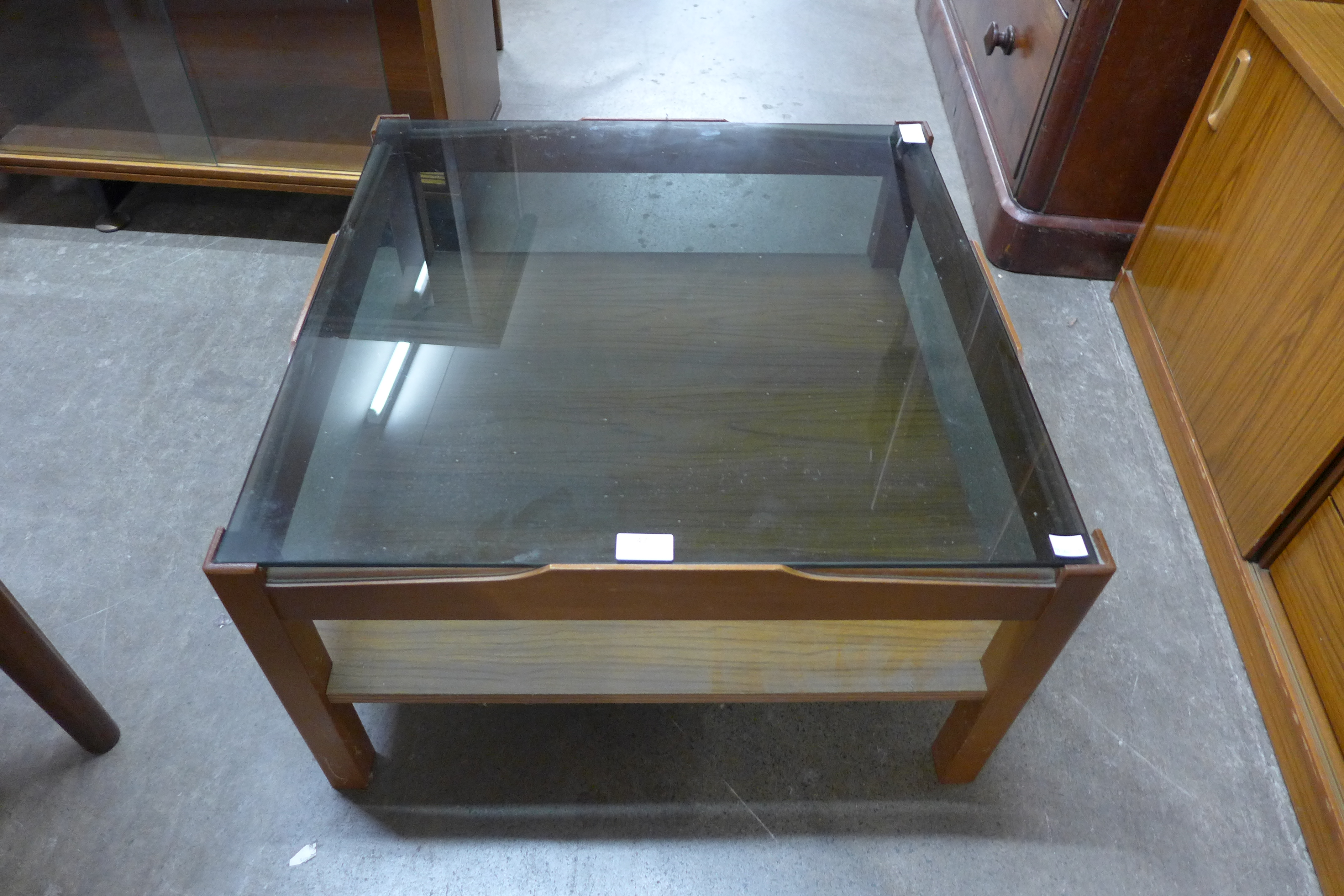 A Myer teak and smoked glass coffee table