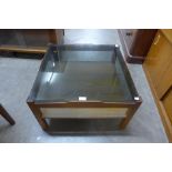 A Myer teak and smoked glass coffee table