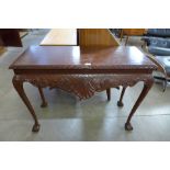 A carved mahogany hall table