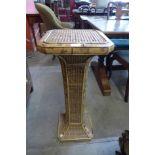 A bamboo and wicker jardiniere stand