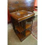 An Edward VII style inlaid mahogany revolving bookcase