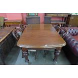 A Victorian mahogany extending dining table and four chairs