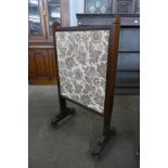 A Victorian mahogany and embroidered screen