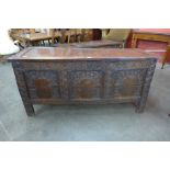 A 17th Century carved oak coffer