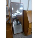 A teak framed mirror