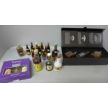 A collection of alcohol miniatures including a set of three Jack Daniels, other whisky and miniature