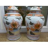 A pair of large Chinese temple jars, tops lacking, 46cm