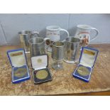 A collection of rowing related items including tankards and medals