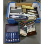 A collection of boxed cutlery, some unopened, including sets