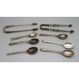 Six silver spoons and two pairs of silver sugar bows, 138g