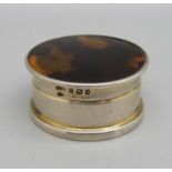 A silver and tortoiseshell pill box, London 1919, diameter 4cm