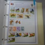 Stamps;-Philatelia album with GB and World stamps (wildlife themed) and box with GB ‘kiloware’ and