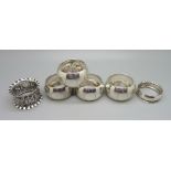 A set of four silver napkin rings and two other silver napkin rings, 105g