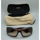 A pair of Chanel sunglasses