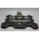 A papier mache inkstand inlaid with mother of pearl