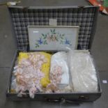 A suitcase of lace and linen