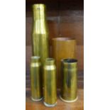 Four shell cases, one marked 1918, and one other cylindrical case