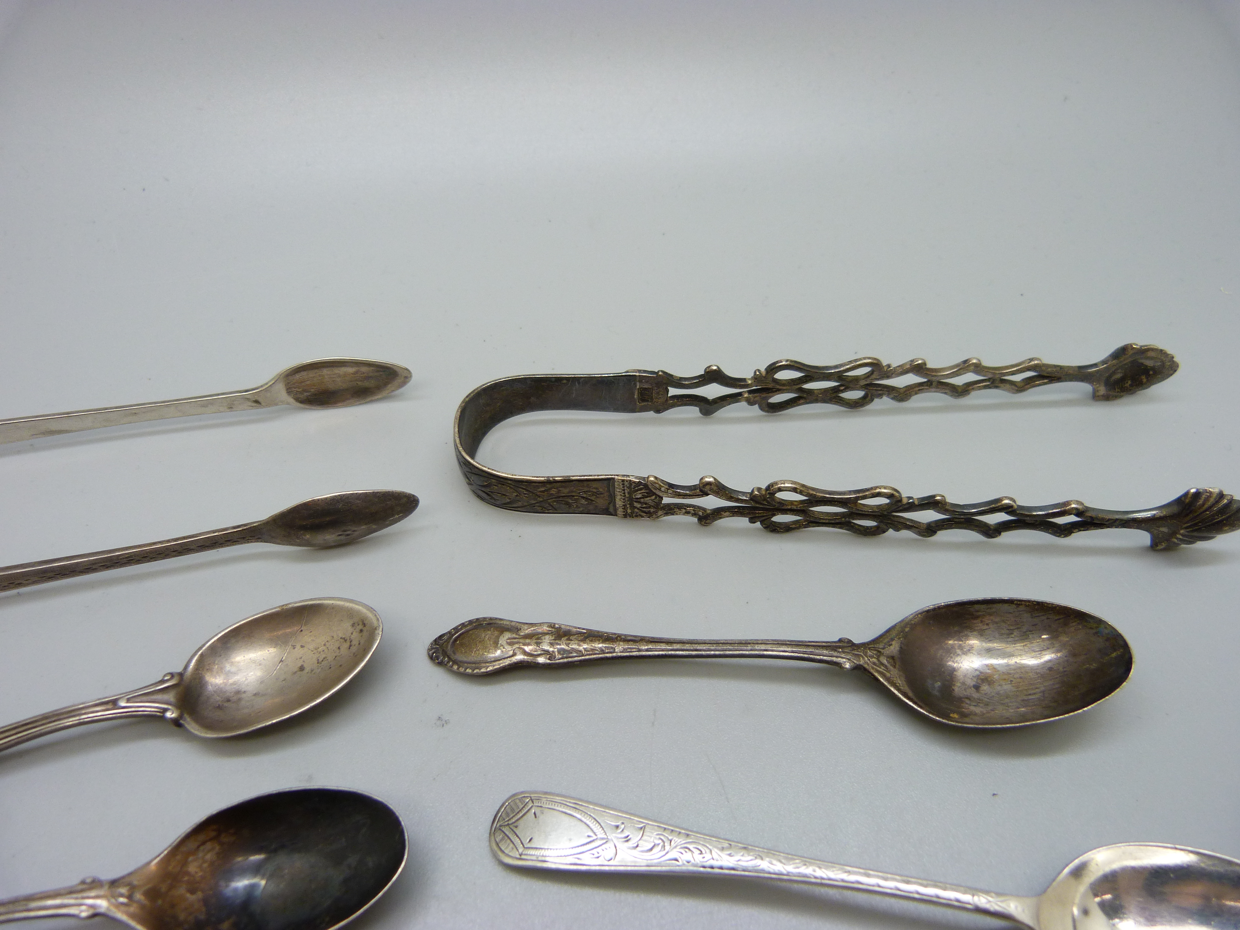 Six silver spoons and two pairs of silver sugar bows, 138g - Image 2 of 2