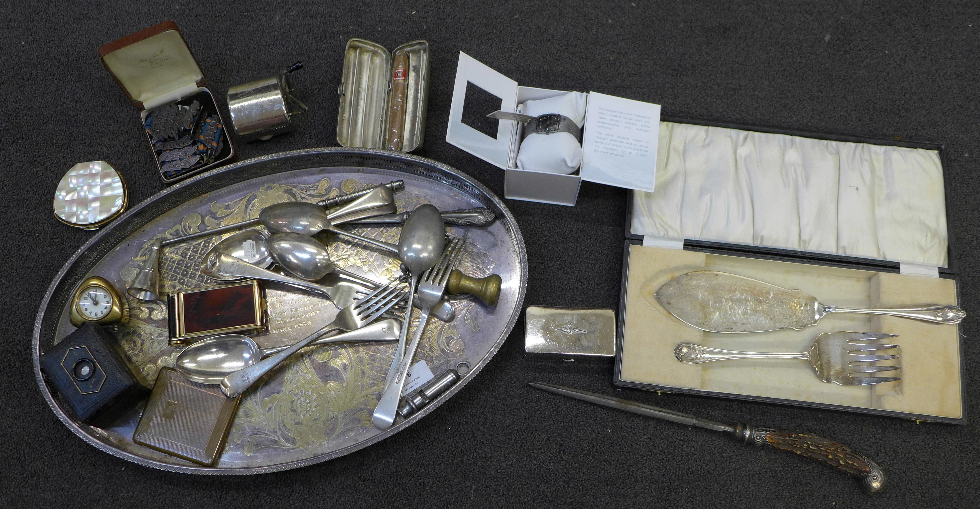 Assorted items; a small clock, a camera, a compact, a whistle, a cigar case, etc.