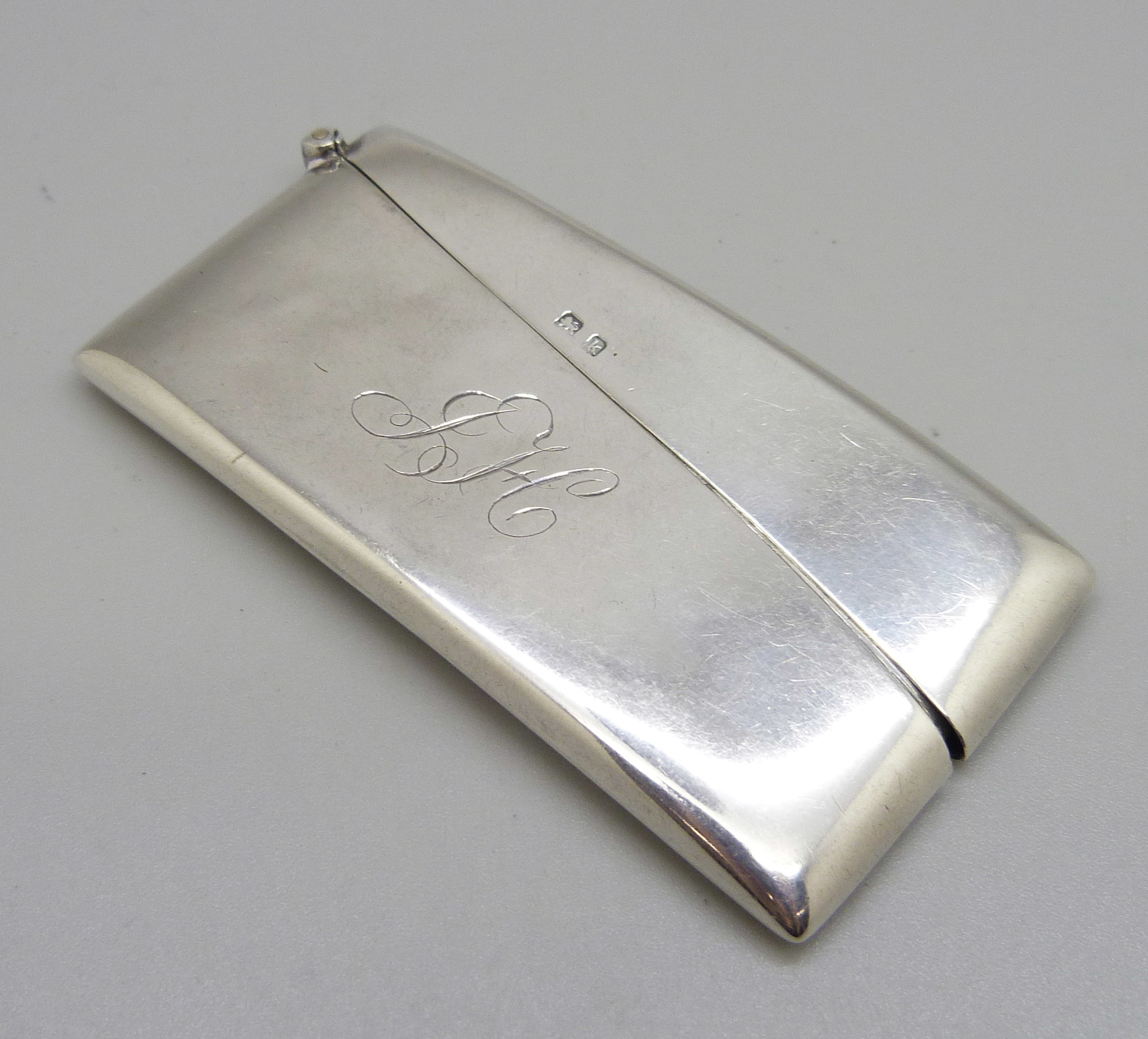 A silver card case, Birmingham 1910, with initials