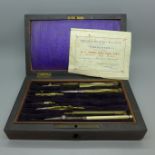 A Victorian drawing set, c.1889, with proficiency award certificate, some veneer a/f