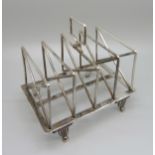 A Victorian silver toast rack, London 1890, 229g
