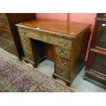 A George III mahogany kneehole desk