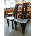 A pair of Italian black high gloss chairs, manner of Pietro Costantini
