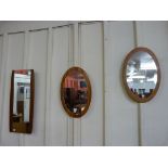 Four teak framed mirrors