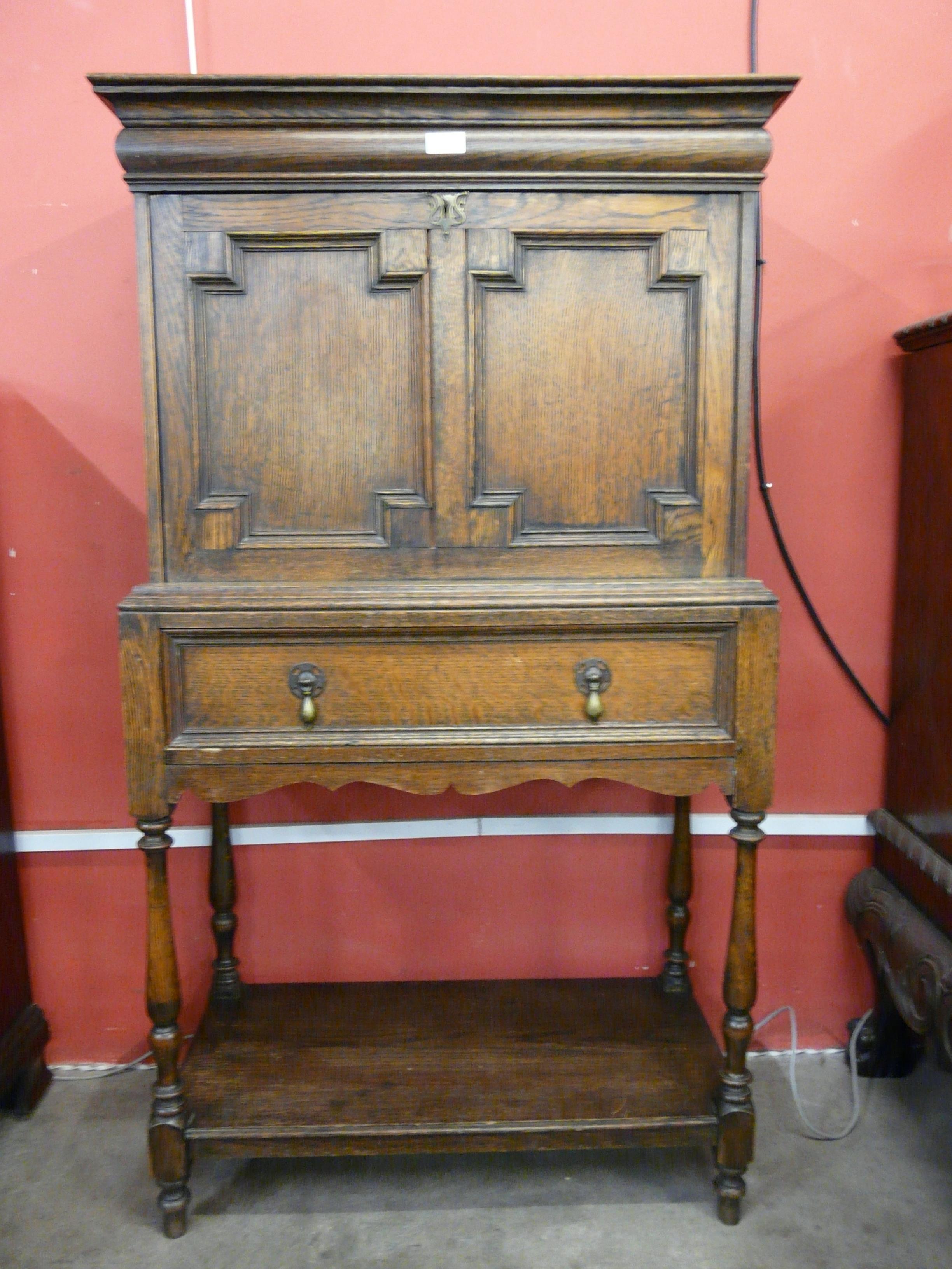 An early 20th Century oak geometric moulded escritoire