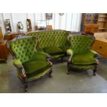 A Victorian style mahogany and green fabric upholstered three piece suite