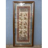 A framed Iranian wall hanging depicting polo players